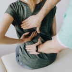 doctor-examines-woman-s-back