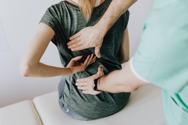 doctor-examines-woman-s-back