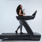 a-woman-is-walking-on-a-treadmill