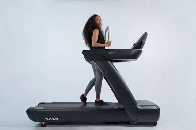 a-woman-is-walking-on-a-treadmill