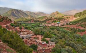 high-angle-shot-of-brown-buildings-near-mountains