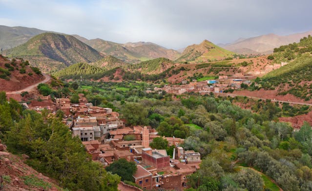 high-angle-shot-of-brown-buildings-near-mountains