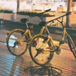 two yellow dutch bicycles parking on street