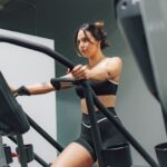 a woman on a treadmill in a gym